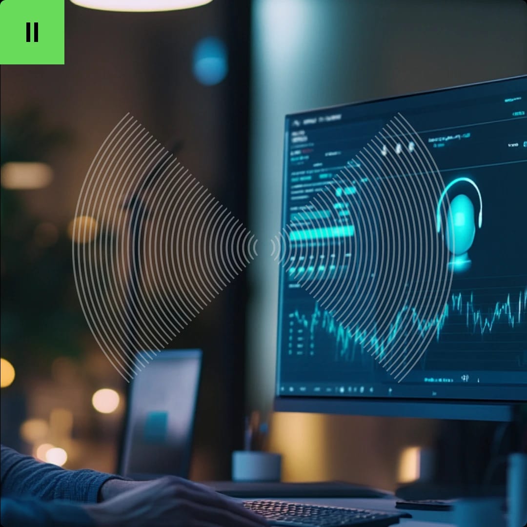 A person working at a computer with a digital interface displaying data and a headset icon on the screen.