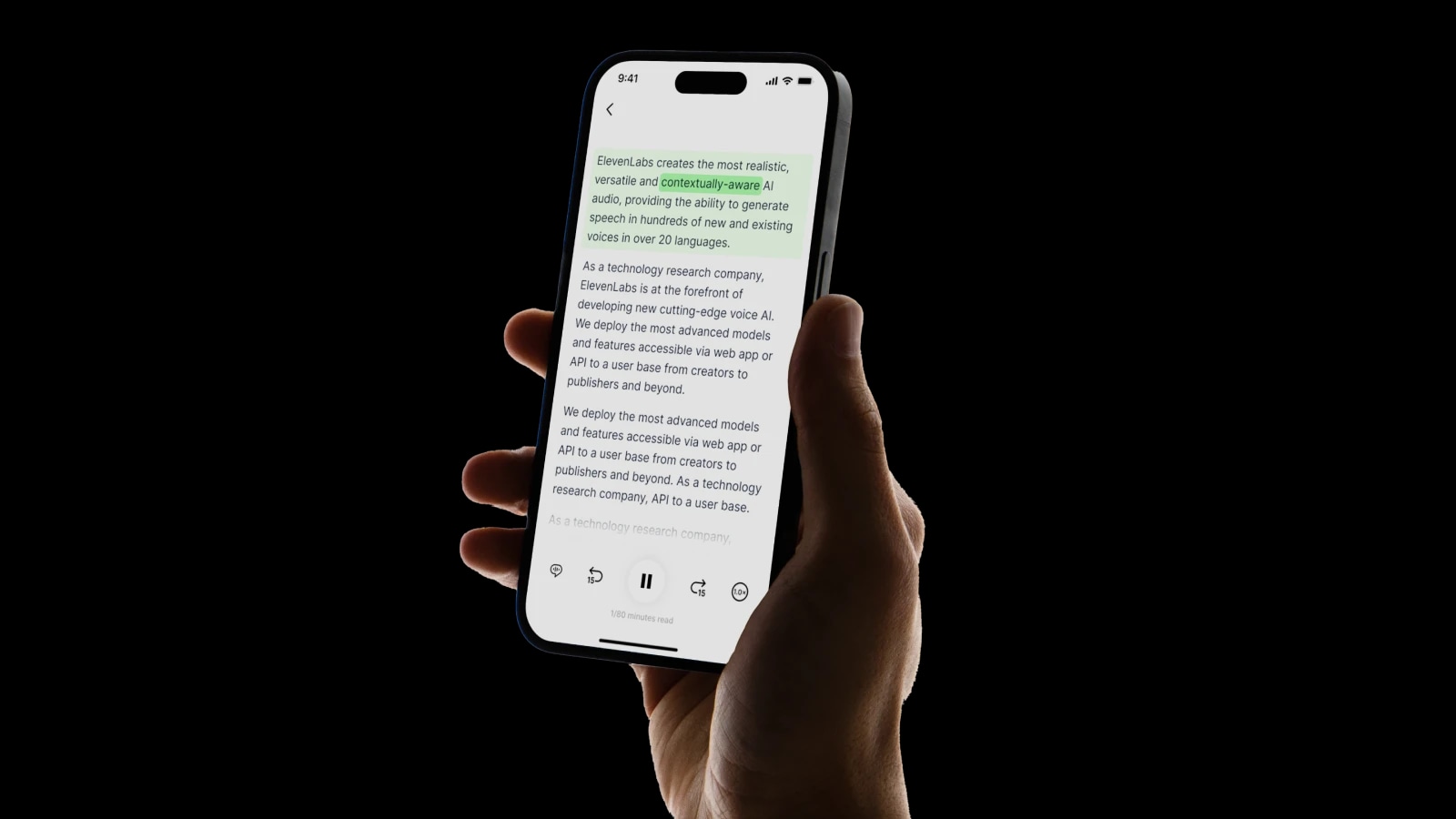 A hand holding a smartphone displaying a text-to-speech app with text on the screen.