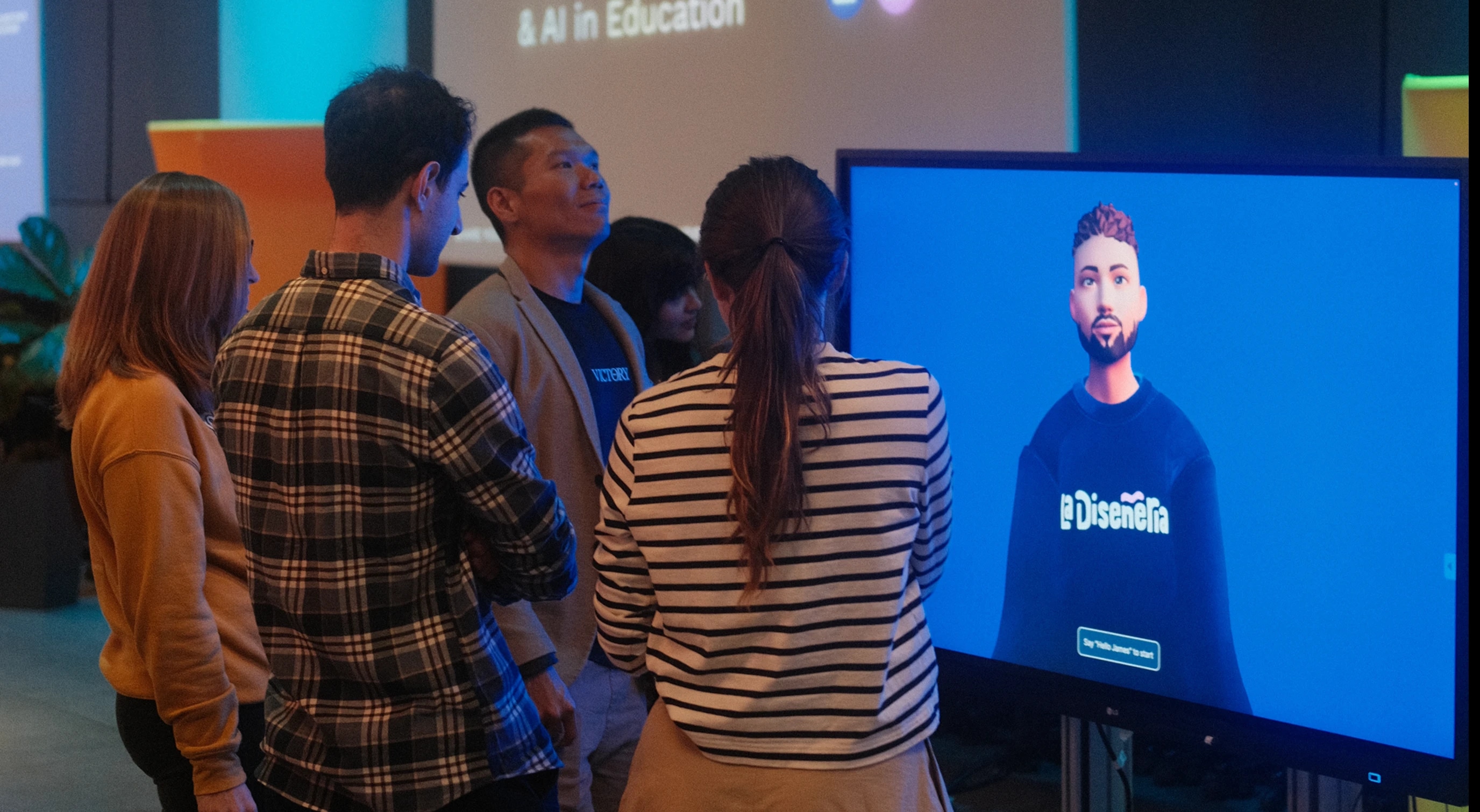 people looking at an AI 3D figure on a screen
