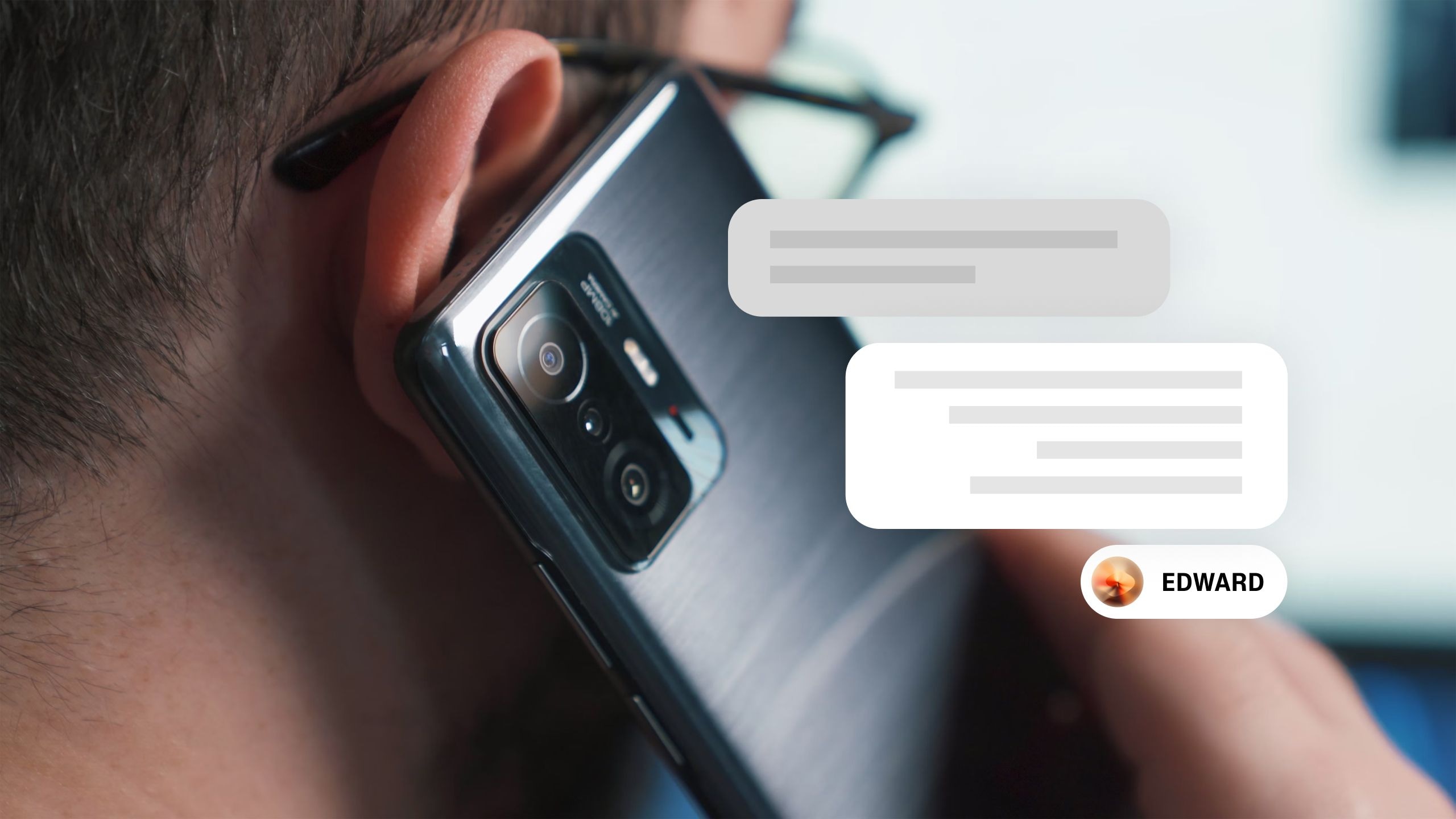 Close-up of a person holding a smartphone with a chat overlay on the screen.