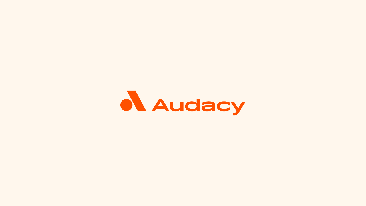 Audacy logo in orange on a light background.