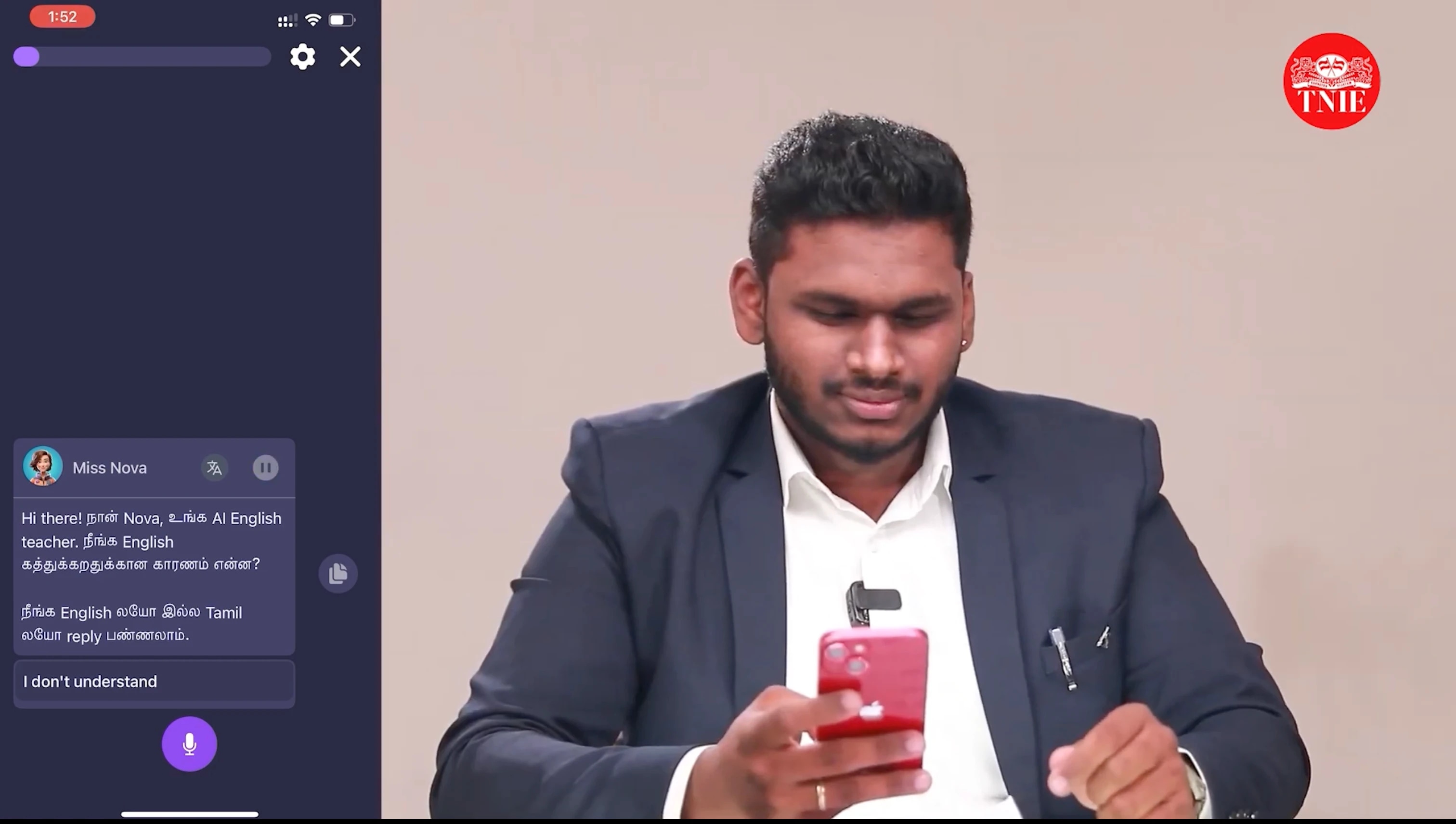 A man in a suit looking at his phone, with a chat window on the left side of the image.