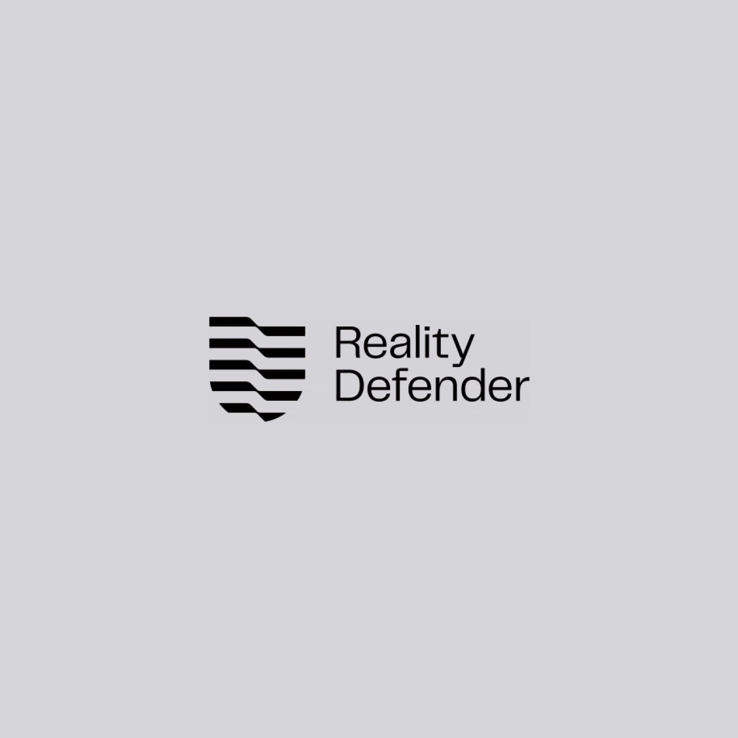Reality Defender logo with a shield icon and the text "Reality Defender" on a gray background.