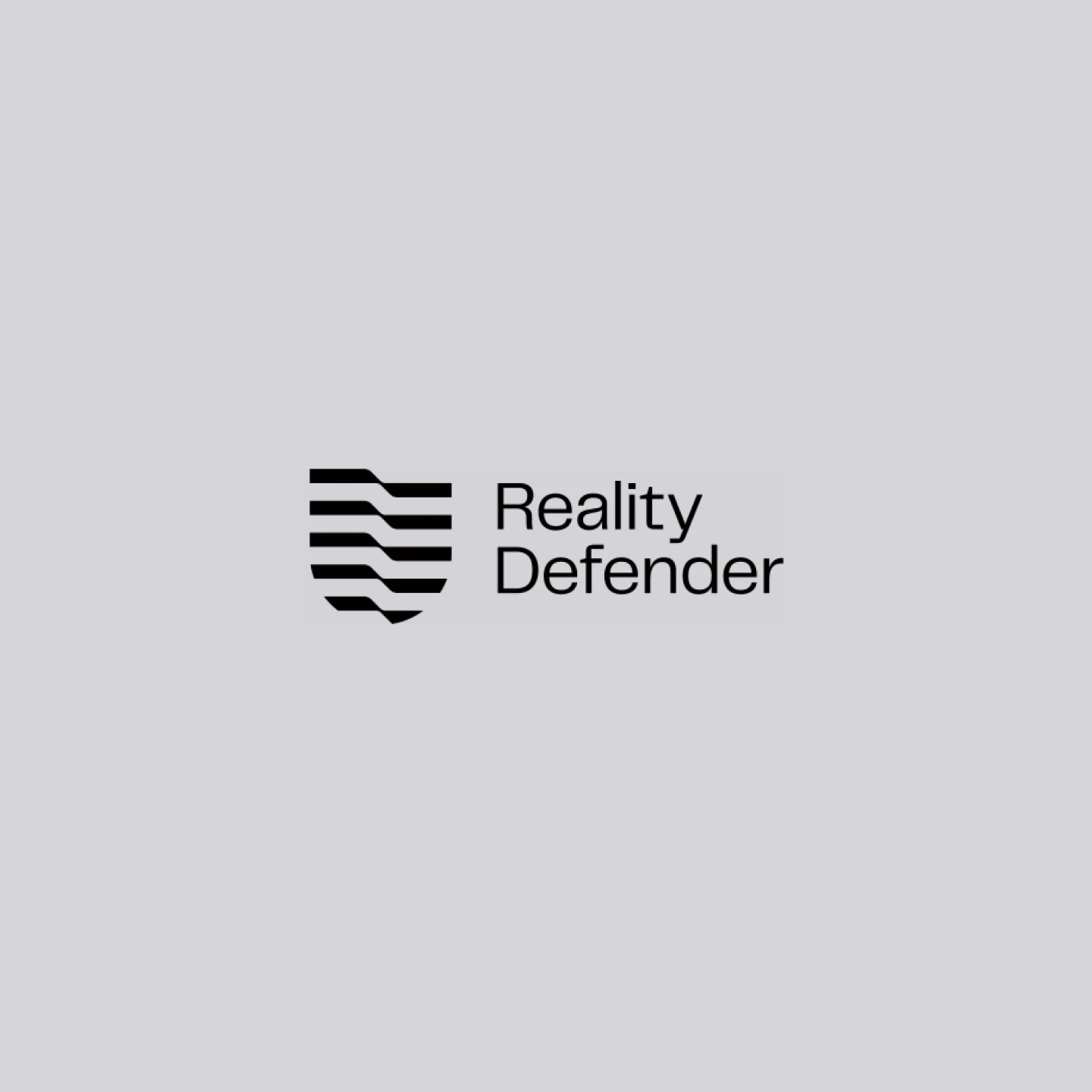 Reality Defender logo with a shield icon and the text "Reality Defender" on a gray background.