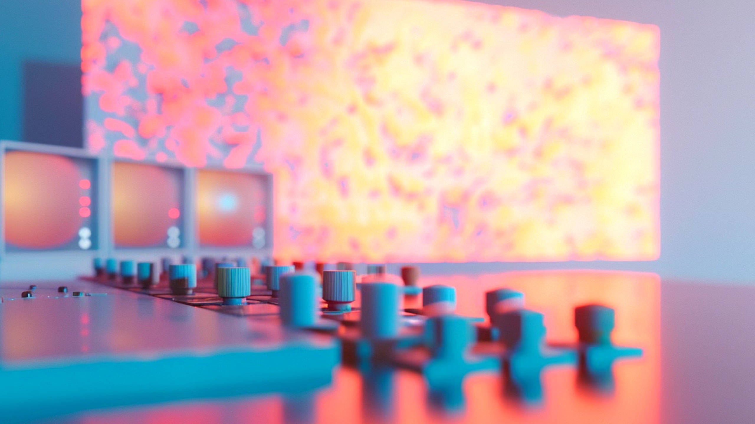 Close-up of a music production mixer with colorful LED screens in the background.